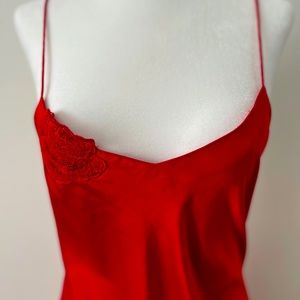 Red silk slip dress with thigh slit